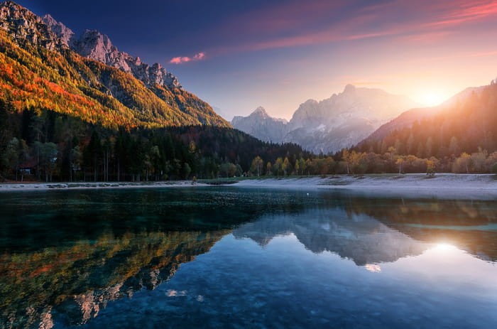 Fototapeta Incredible Nature Landscape. Amazing Lake Jasna With Of A Mirror Reflection. Stunning Vivid Nature Scenery Of Slovenia. Wild Nature Image. Concept Ideal Resting Place. Scenic Image In Autumn Time