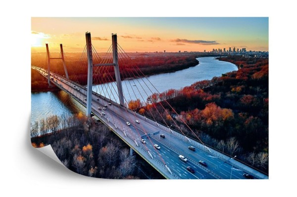 Fototapeta Beautiful Panoramic Aerial Drone View To Cable-Stayed Siekierkowski Bridge Over The Vistula River And Warsaw City Skyscrapers  Poland In Gold Red Autumn Colors In November Evening At Sunset