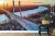 Fototapeta Beautiful Panoramic Aerial Drone View To Cable-Stayed Siekierkowski Bridge Over The Vistula River And Warsaw City Skyscrapers  Poland In Gold Red Autumn Colors In November Evening At Sunset